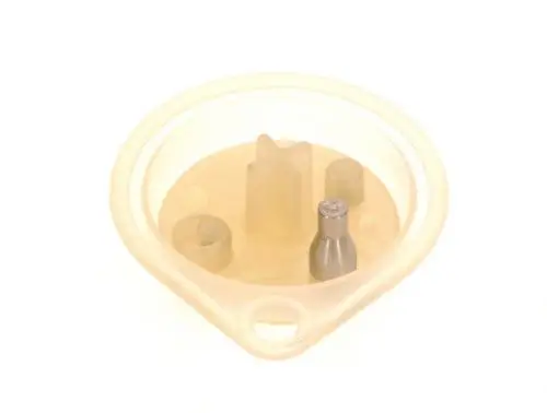 Membran von Bosch in ovaler Form, transparent mit einem zentralen und mehreren seitlichen Anschlüssen für Verbindungen.
